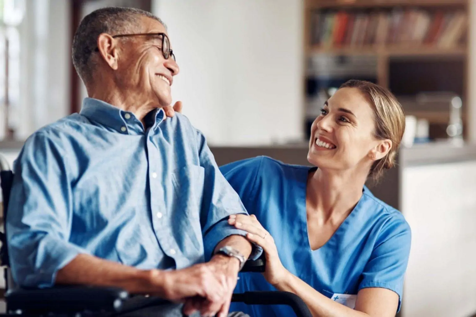 Nurse smiling with an older man