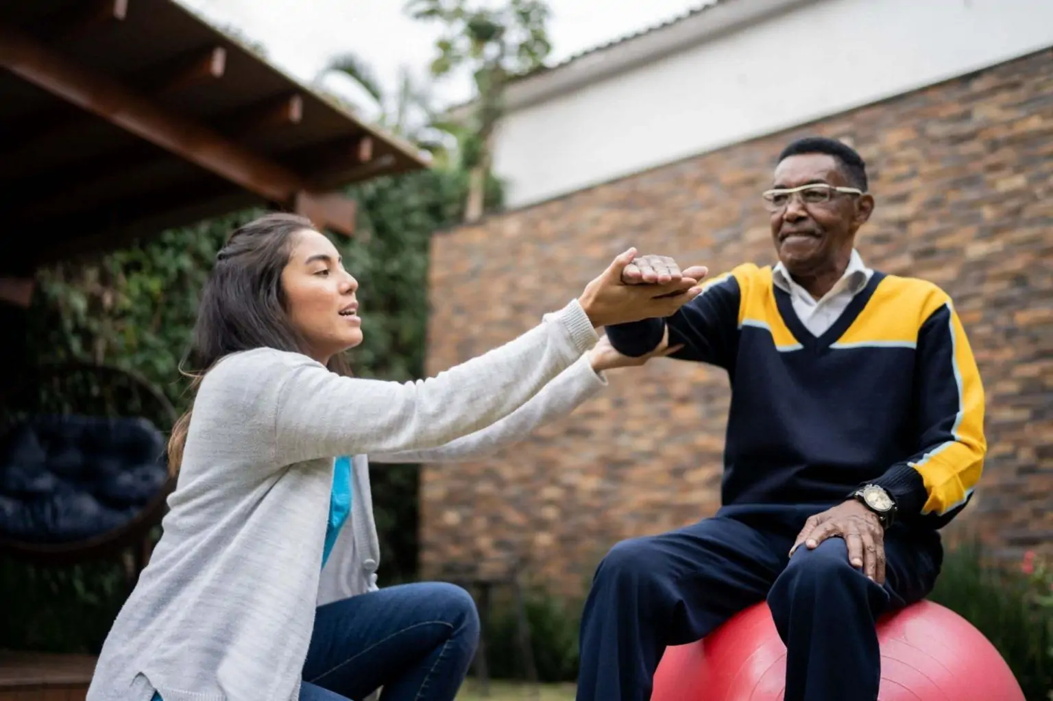 Carer supporting a client outdoors