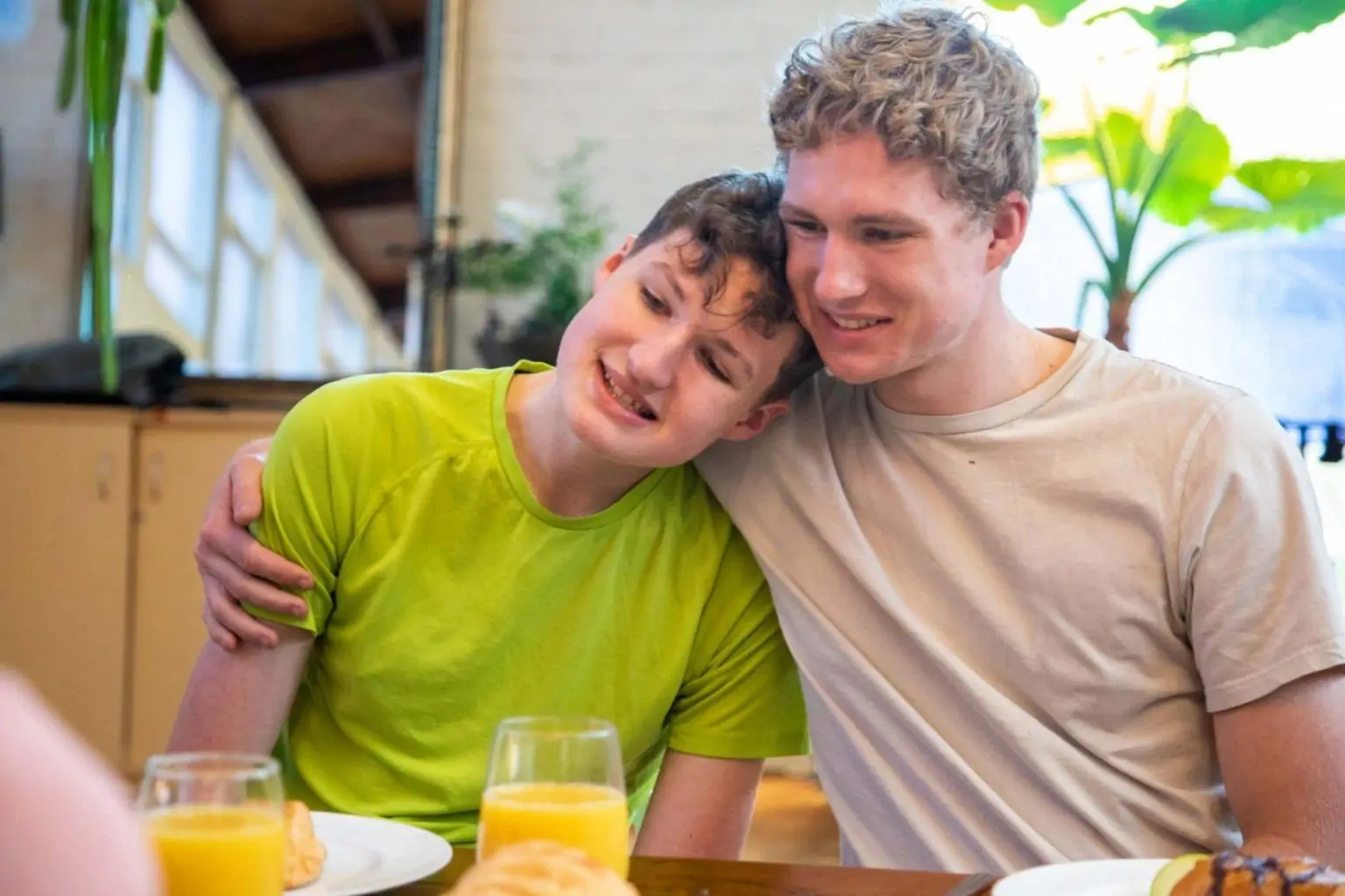 Two young men smiling together